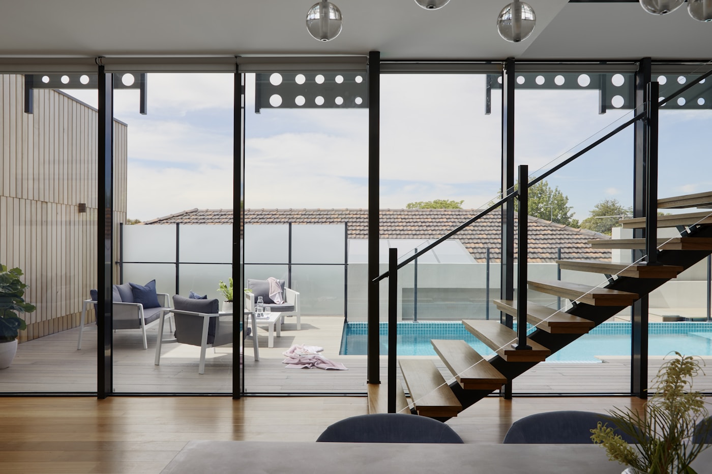 Pool terrace seen through a glass wall